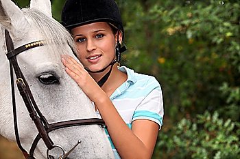 A cute blond and her horse.