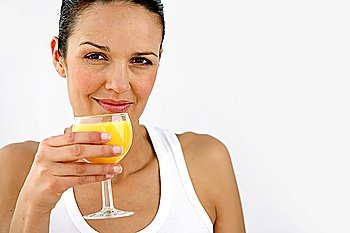 Woman having refreshing glass of orange juice