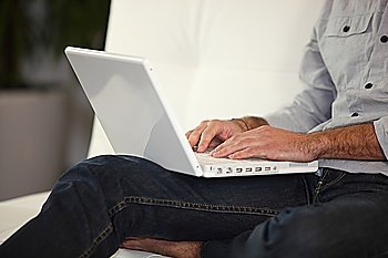 Man typing on a laptop