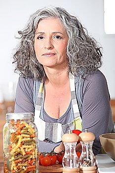 mature woman posing in kitchen