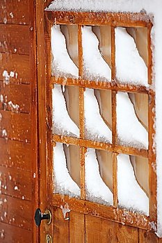 Snow covered chalet window