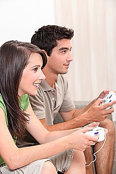 Young couple playing computer games