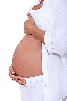 Woman hugging her pregnant belly