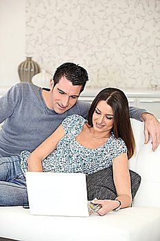 couple on couch with computer