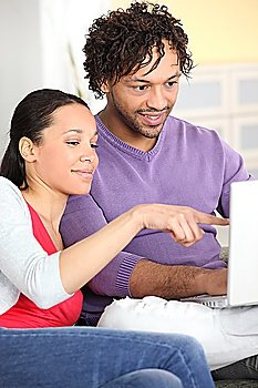 Couple happily browsing the internet