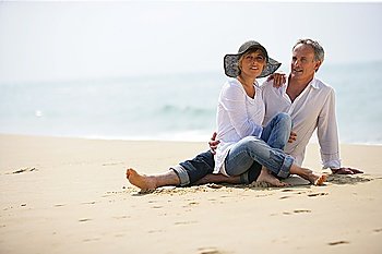 Couple sat on a beach