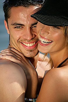 Couple hugging at the beach