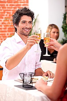 Couple celebrating in restaurant