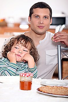 Father having crepes with his child