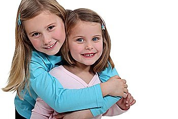 two little girls embracing