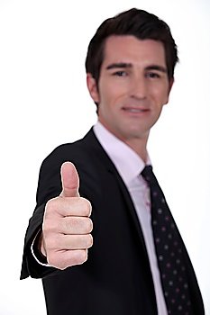 Businessman giving the thumb´s up