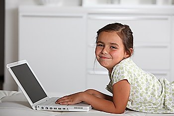 Young girl using a laptop computer