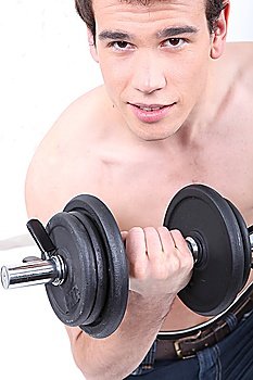 Young man using a barbell