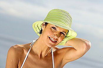 Woman in a bikini and straw hat