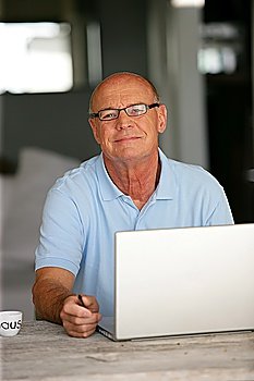 Bald man working from home
