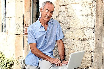 Man with computer front door