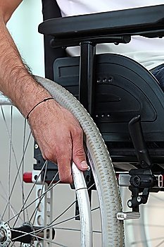 Disabled person confined to a wheelchair