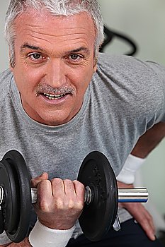 mature man lifting weight