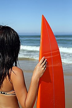 Woman holding a surf board