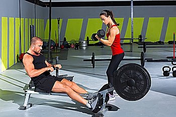 Gym couple with dumbbell weights and fitness power workout