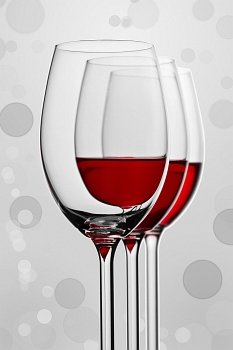 a composition of three wineglasses isolated