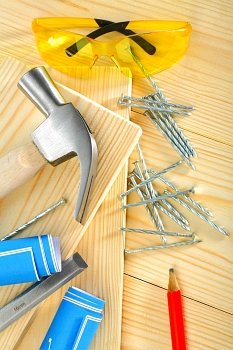 composition of carpentry tools on  wooden background