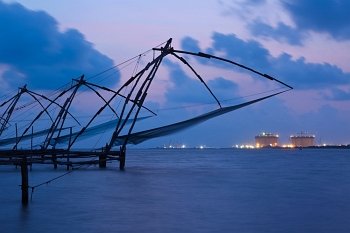 Kochi chinese fishnets in twilight. Fort Kochin, Kochi, Kerala, India