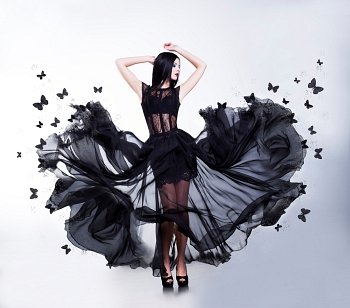 Swing. Sensual Woman in Black Fluttering Dress with Butterflies