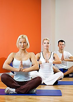 Group of people doing yoga exercise