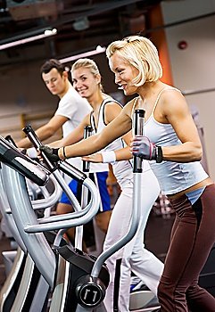Group of people jogging in a gym