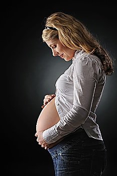 Beautiful pregnant woman expecting a baby