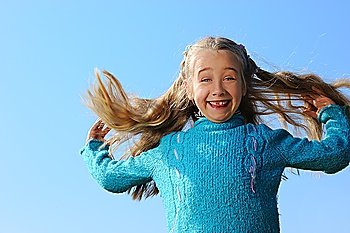 Little girl jumping outdoors