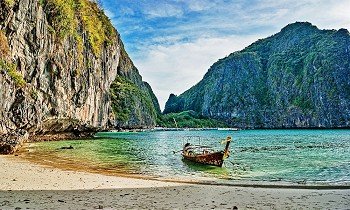 Traditional longtail boat in the famous Maya bay of Phi-phi Leh island, Thailand