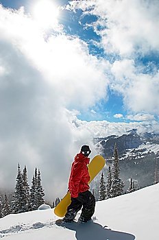 Snowboarder Hiking to Find Fresh Snow