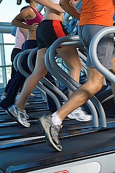 Joggers on Treadmills in Gym