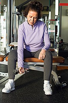 Senior Woman Weightlifting With Dumbbell