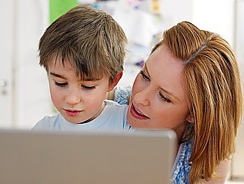 Mother and Son Using Laptop Together
