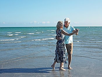 Senior Couple Dancing on Beach