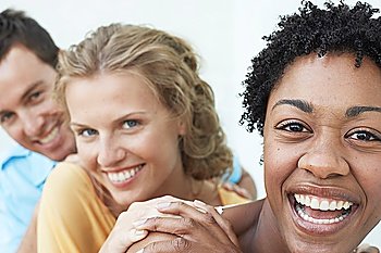 Man and Two Women Laughing