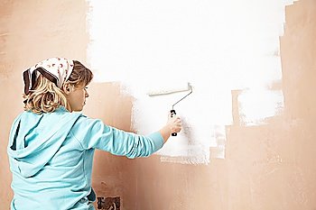 Woman Painting Wall with Roller