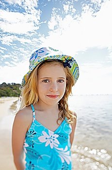 Girl standing on beach portrait