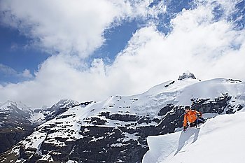 Mountain climber reaching peak