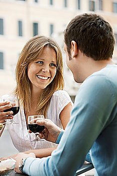 Happy Young Couple Enjoying a Glass of Wine