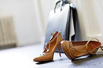 High Heels and Briefcase in Hallway