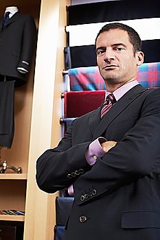 Businessman in clothes store portrait