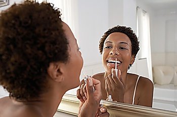 Woman Applying Lip Gloss