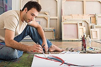 Artist Working on Canvas on Floor of Studio