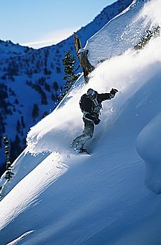 Snowboarder on mountain slope
