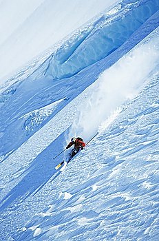 Skier on steep slope elevated view
