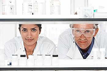Lab Workers Looking Through Shelves